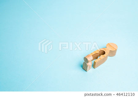 a fallen wooden man with a void in the body  46412110