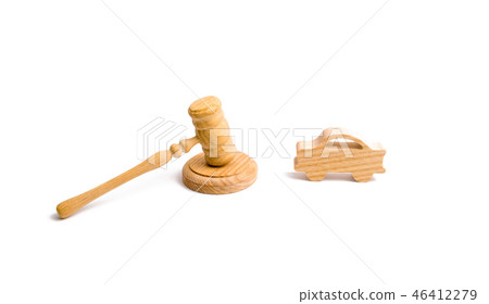 Wooden figurine of a car in the hammer of a judge 46412279