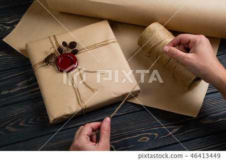 Process of package gift wrapped in craft paper 46413449