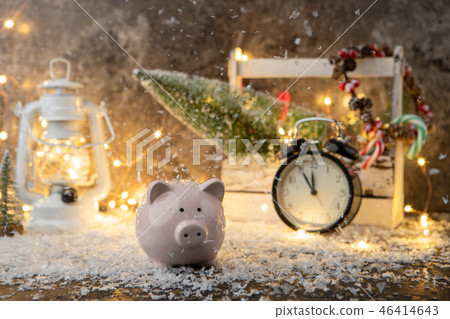 Picture of piggy bank, Christmas decoration of cones and berries, wooden box, red candles, snow 46414643