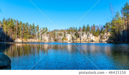 Natural lake in Adrspach rocks on sunny autumn day. Adrspach-Teplice sandstone rock town, Czech Natural lake in Adrspach rocks on sunny autumn day. Adrspach-Teplice sandstone rock town, Czech 46415150