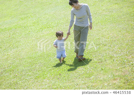 Parent and child holding hands and walking Parent and child holding hands and walking 46415538