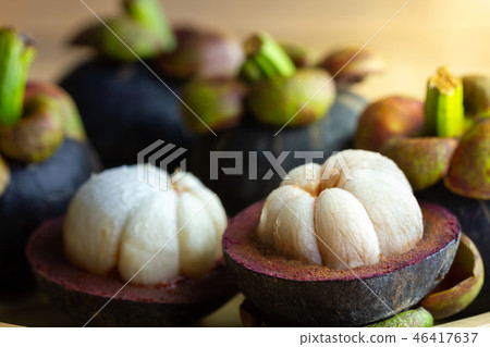 Mangosteen was peeled in a plate on a wooden table Mangosteen was peeled in a plate on a wooden table 46417637