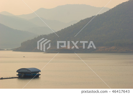 Raft floating on the middle of a dam or lake. 46417643
