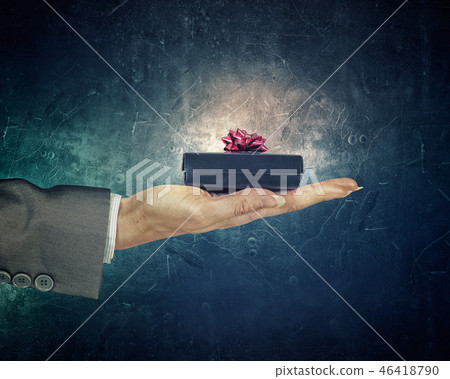 Man presenting his gift Man presenting his gift 46418790