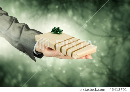 Man presenting his gift Man presenting his gift 46418791