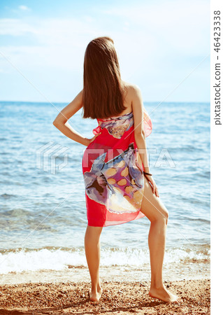girl standing by the sea 46423338