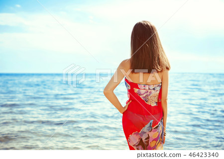 girl standing by the sea 46423340