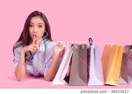 Asian smiling woman so happy with her shopping Asian smiling woman so happy with her shopping 46423617