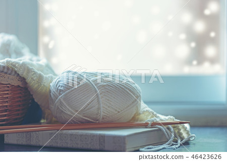 Cozy winter home with warm knitted sweaters Cozy winter home with warm knitted sweaters 46423626