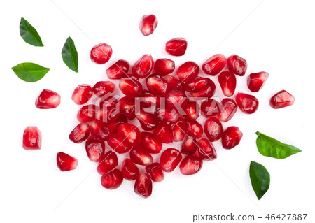 pomegranate seeds with leaves isolated on white background. Top view. Flat lay pattern 46427887