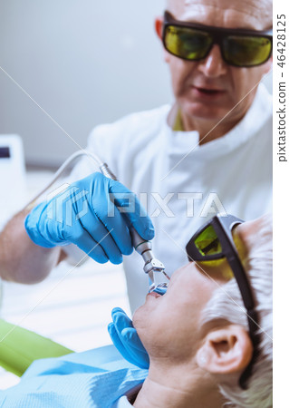 Laser Teeth Whitening. Dentist With Senior Female Patient 46428125