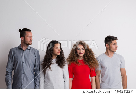 Portrait of young group of friends in a studio, stand out from the crowd concept. 46428227