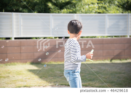 Boys playing in the garden 46429618