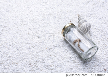 White sand, white goose, white background, summer feeling, glass bottle, letter, chestnut, shell 46430884