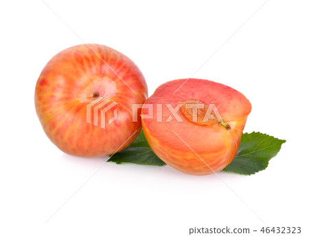 whole and half cut ripe fresh pluot on white 46432323