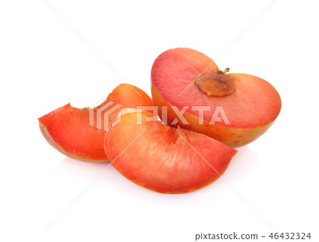 half and sliced fresh pluot on white background 46432324