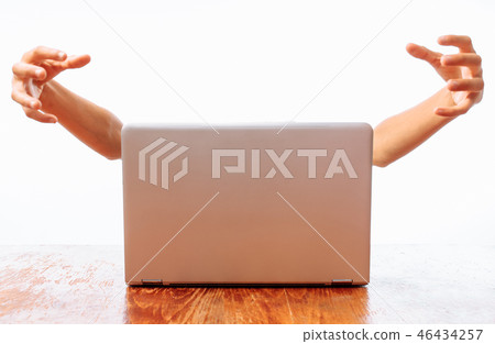 Hands that come out of the computer, the concept Hands that come out of the computer, the concept 46434257