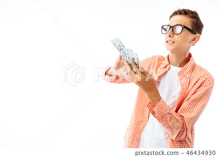 A young man with glasses throws a hundred dollars A young man with glasses throws a hundred dollars 46434930