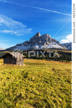 Mountain hut with beautiful peak in the background 46435244