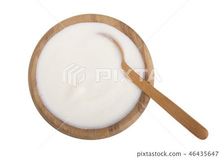 yogurt in a wooden bowl isolated on white background top view 46435647