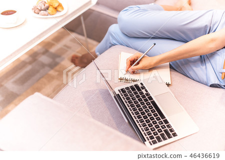 Focus on open laptop and female hand Focus on open laptop and female hand 46436619