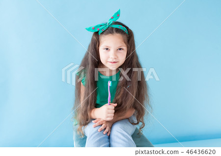 little girl with out a tooth with a toothbrush dent little girl with out a tooth with a toothbrush dent 46436620