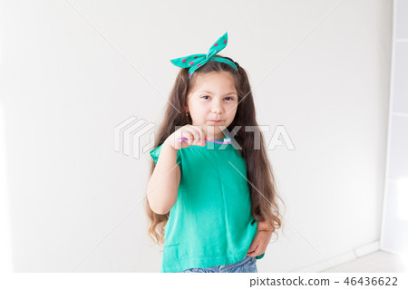 little girl with out a tooth with a toothbrush dent little girl with out a tooth with a toothbrush dent 46436622