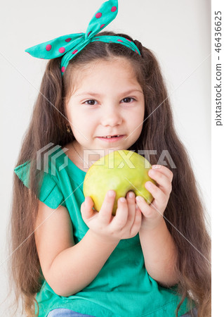 beautiful girl holding a Green Apple fruit 46436625