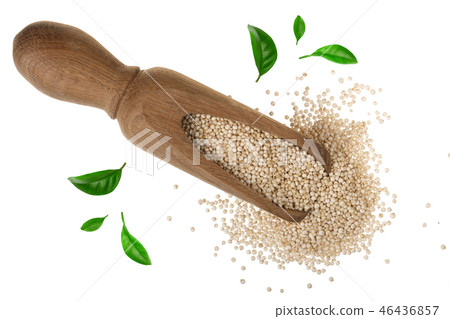 red quinoa seeds in wooden scoop decorated with green leaves isolated on white background. Top view red quinoa seeds in wooden scoop decorated with green leaves isolated on white background. Top view 46436857