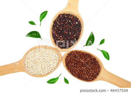 Black red white quinoa seeds in wooden spoon decorated with green leaves isolated on white 46437509