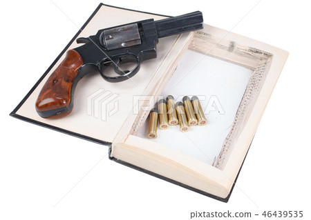 Revolver gun with cartridges hidden in a book 46439535