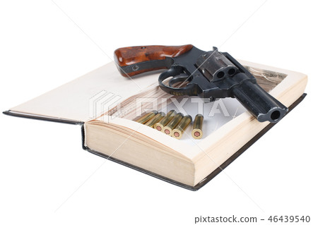 Revolver gun with cartridges hidden in a book 46439540