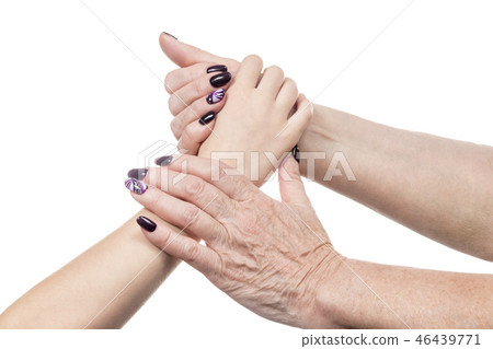 Female old hand holds a child palm Female old hand holds a child palm 46439771
