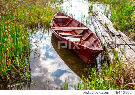 Old fishing wooden boat at the lake 46440193