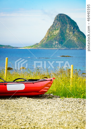 Sea coast with red canoe on shore Andoya Norway Sea coast with red canoe on shore Andoya Norway 46440395