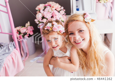 Lovely woman and girl on a soft carpet in their house 46441162