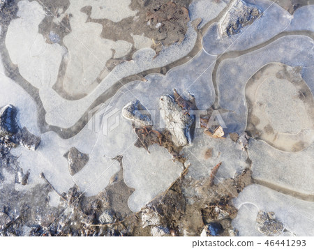 Thin ice in a puddle Thin ice in a puddle 46441293