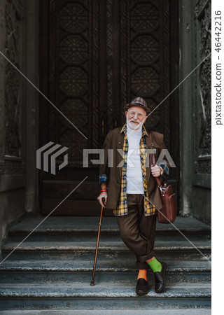Cheerful stylish old man on urban background 46442216