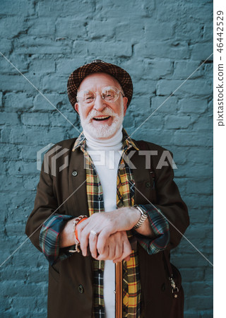 Happy elderly man with hat on the street 46442529