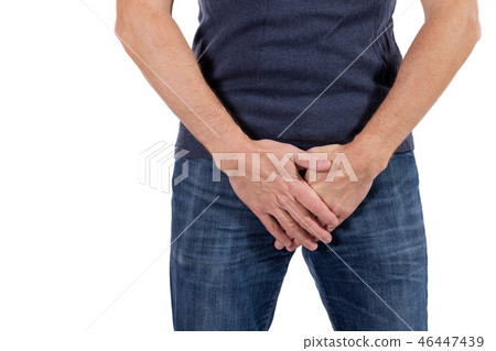 Man holding his urethra in pain. Men problems on 46447439
