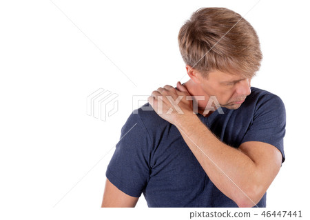 Man holding his sore shoulder trying to relieve Man holding his sore shoulder trying to relieve 46447441