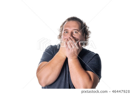 Portrait of amazed man covering his mouth 46447928