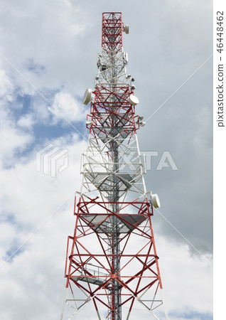 Communication cell tower against cloudy sky 46448462