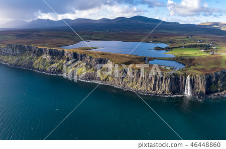 Aerial view of the dramatic coastline at the cliffs by Staffin with the famous Kilt Rock waterfall - 46448860