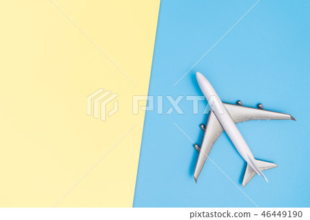 Toy plane trave lworld concept on blue yellow 46449190
