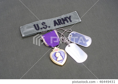 Purple Heart award on US ARMY green uniform Purple Heart award on US ARMY green uniform 46449431