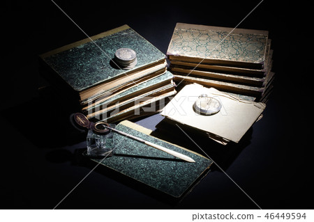 old books, papers, ink pen and inkpot on black old books, papers, ink pen and inkpot on black 46449594