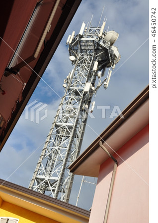 Telecommunication tower in urban space 46450742