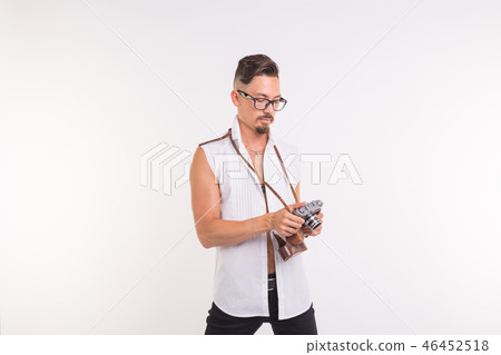Technologies, photographing and people concept - handsome young man with retro camera over white Technologies, photographing and people concept - handsome young man with retro camera over white 46452518